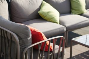 “Close-up of waterproof garden sofa cushions with durable weather resistant fabrics”